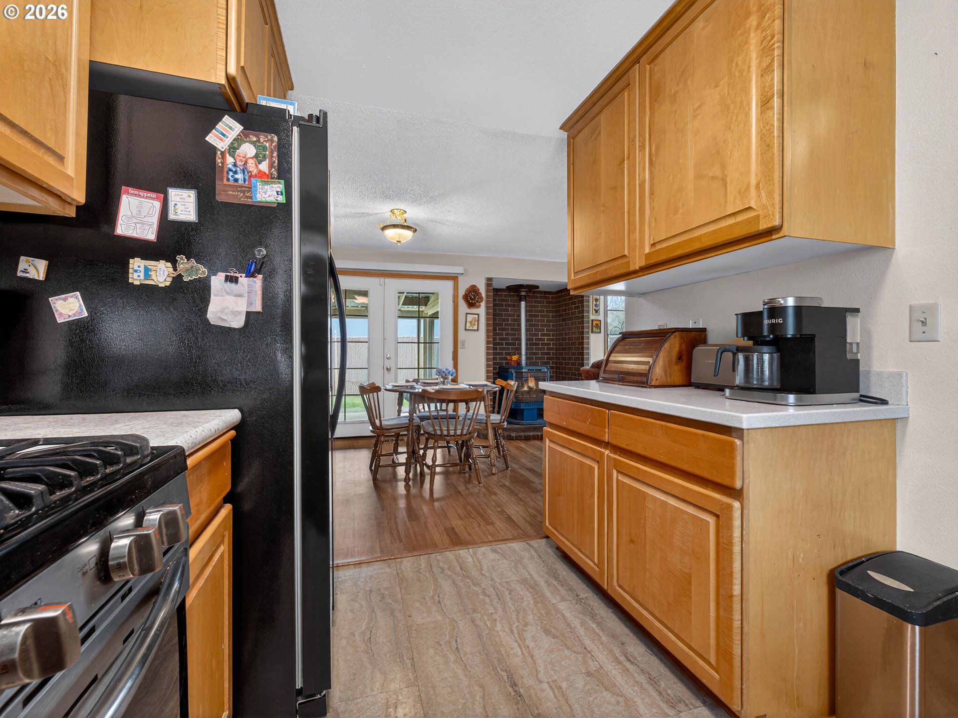 3025 Northeast 29th Street Gresham, OR 97030 - Photo 11 of 33 a kitchen with stainless steel appliances granite countertop a stove a sink and a refrigerator