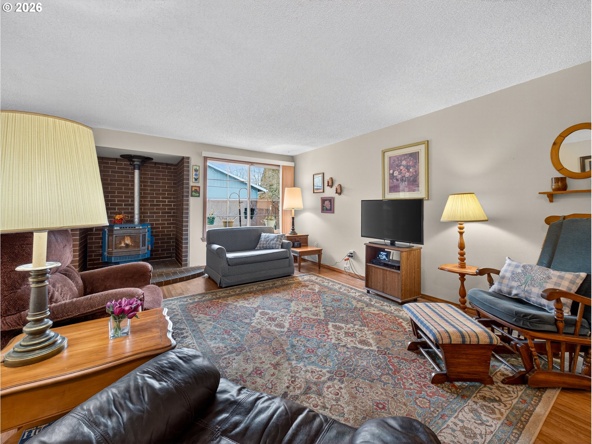 3025 Northeast 29th Street Gresham, OR 97030 - Photo 3 of 33 a living room with furniture and a flat screen tv