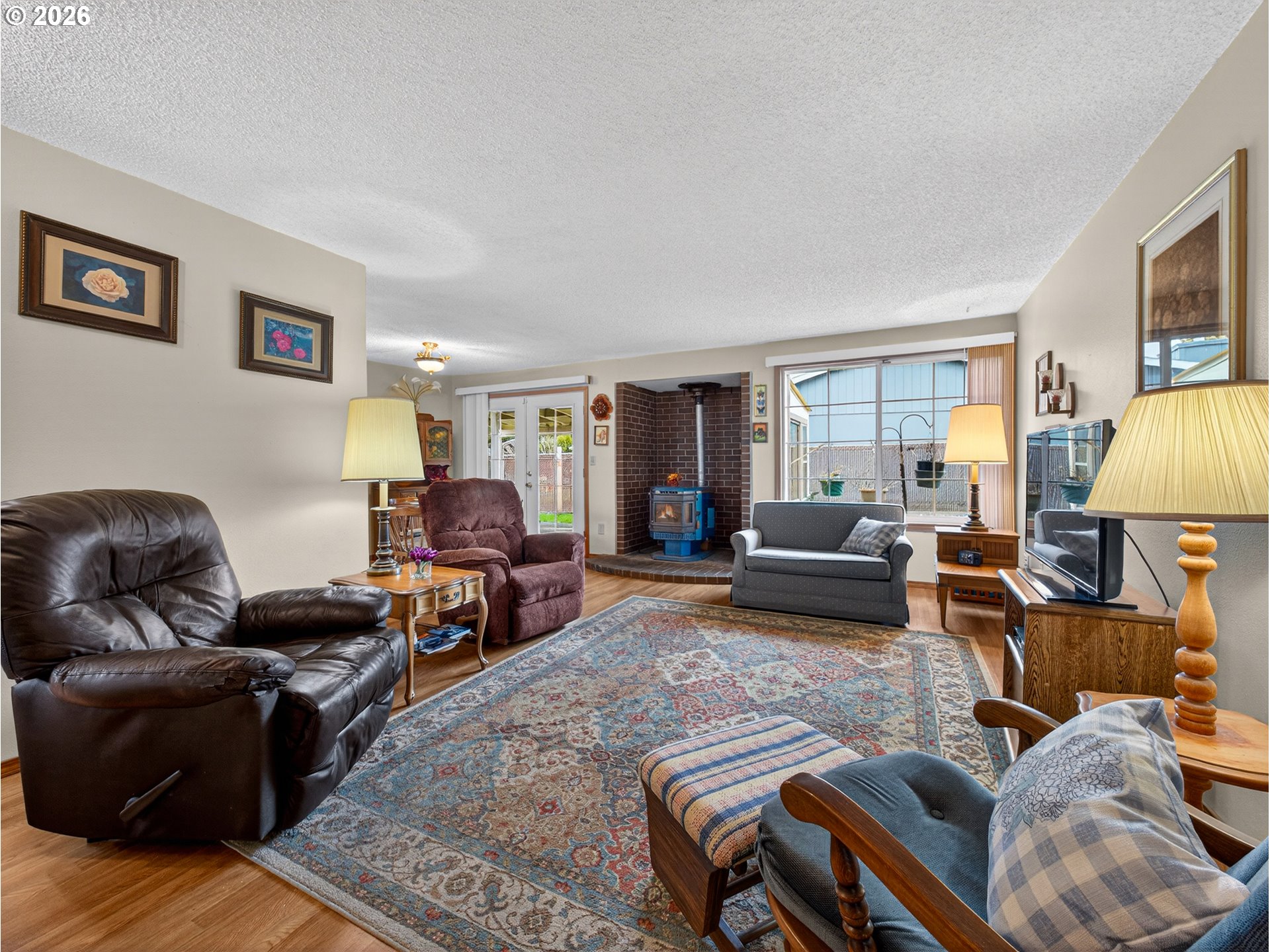 3025 Northeast 29th Street Gresham, OR 97030 - Photo 4 of 33 a living room with furniture ceiling fan and a window