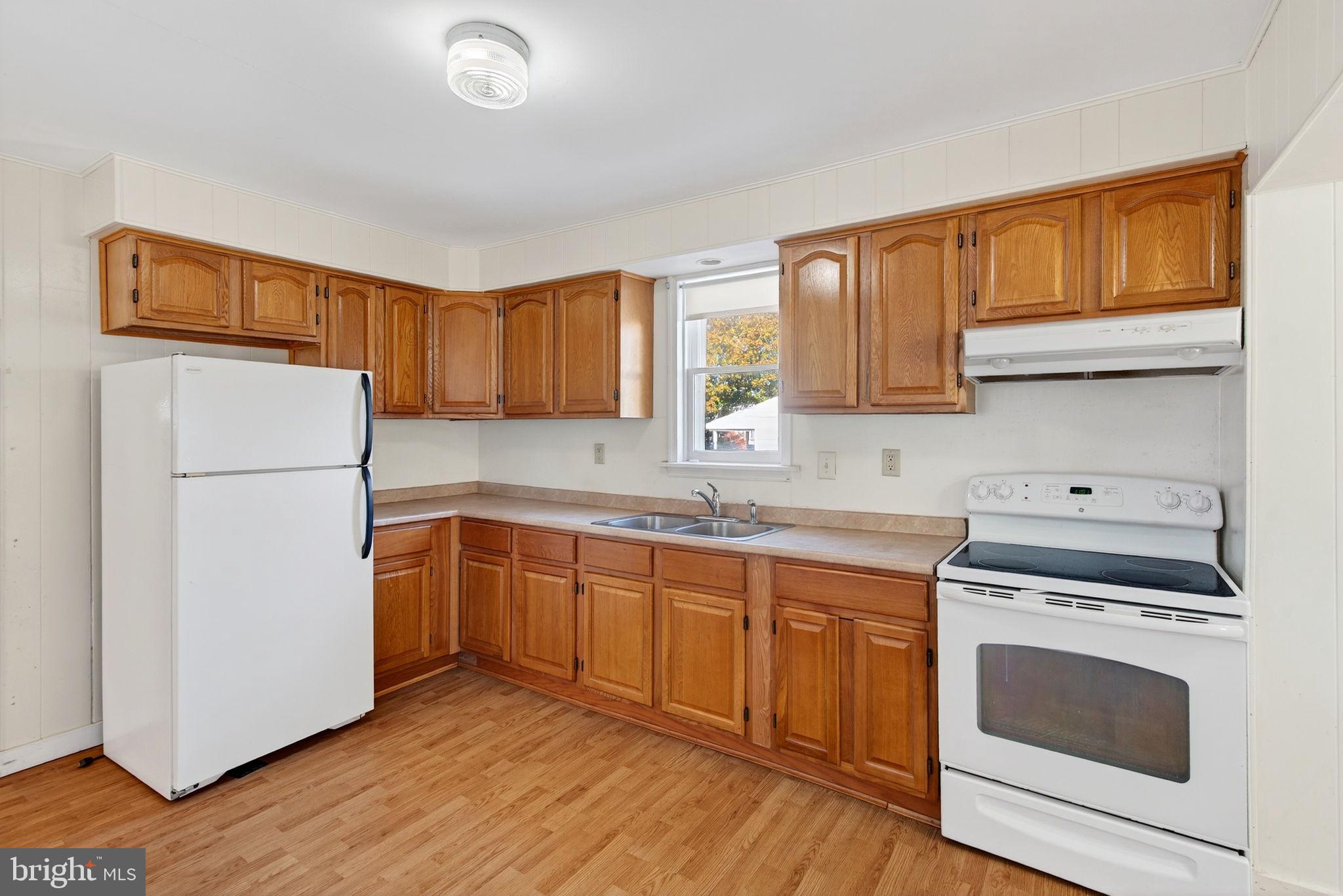 1705 Virginia Avenue Dover, PA 17315 - Photo 12 of 41 a kitchen with a sink cabinets stainless steel appliances and a window