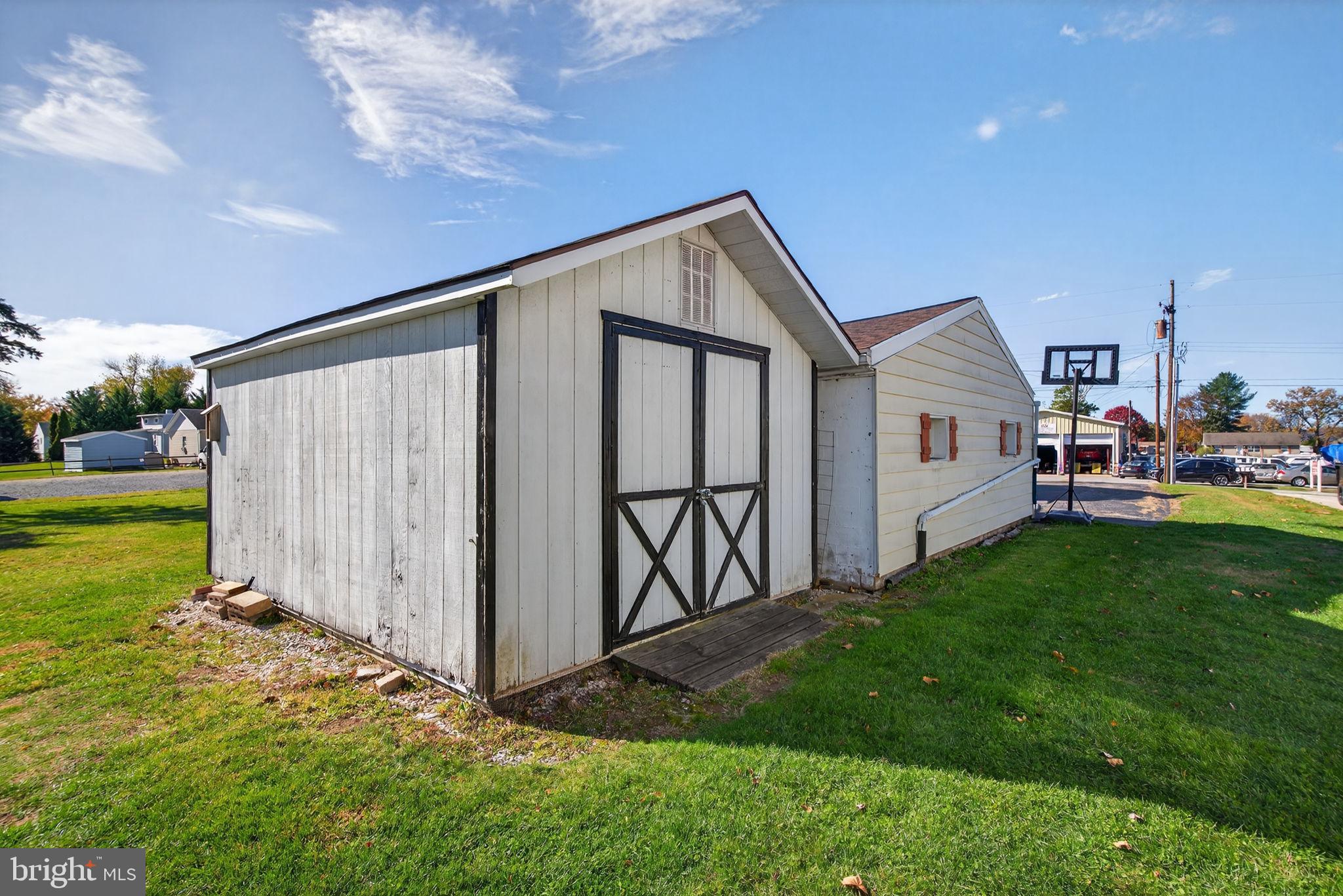 1705 Virginia Avenue Dover, PA 17315 - Photo 32 of 41 a backyard of a house with table and chairs