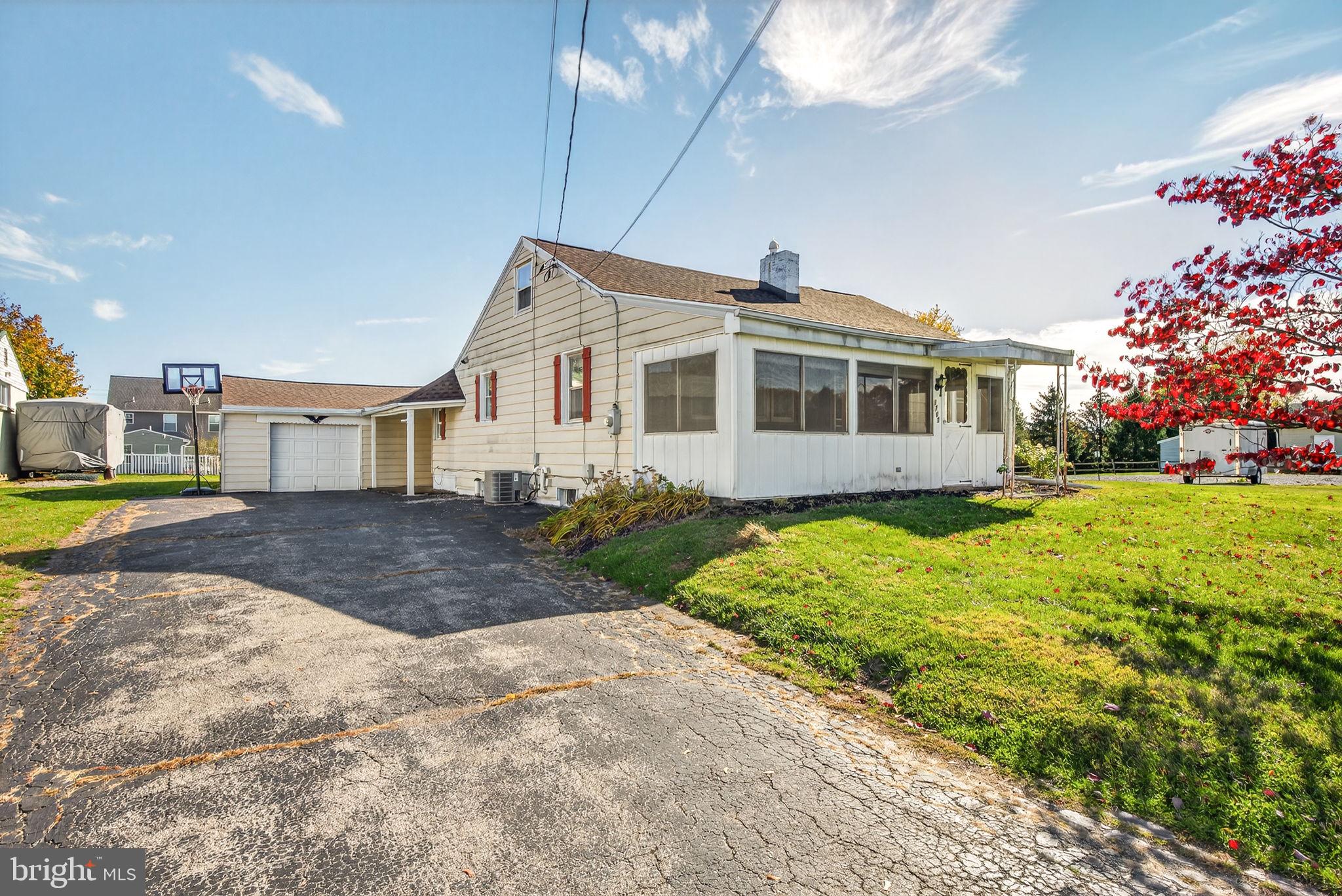 1705 Virginia Avenue Dover, PA 17315 - Photo 4 of 41 a front view of a house with garden