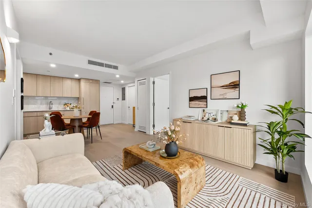 a living room with furniture and a table