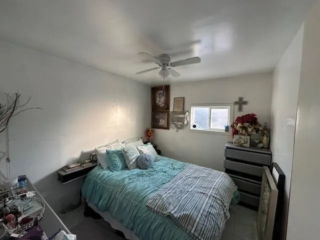 a kitchen with granite countertop a sink cabinets and stainless steel appliances