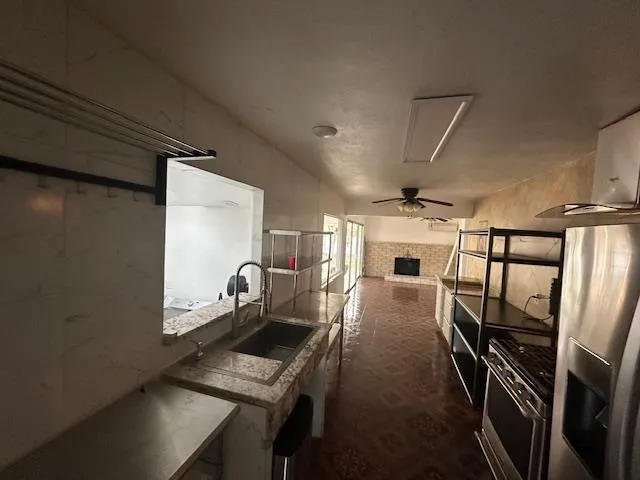 a view of a livingroom with a flesh screen tv