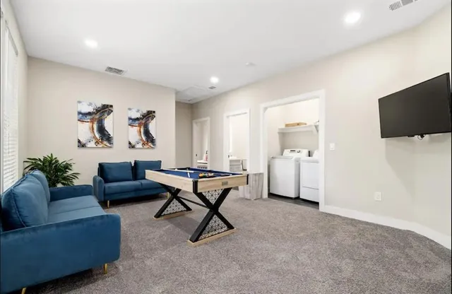 a bedroom with a bed and a chair