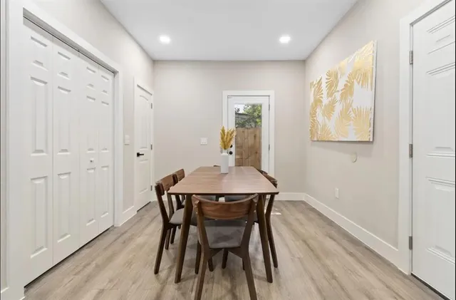 a room with furniture pool table and a window