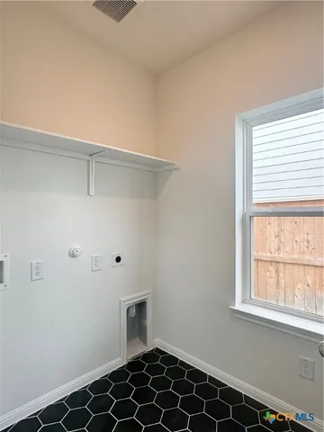 a view of a closet area with wooden floor
