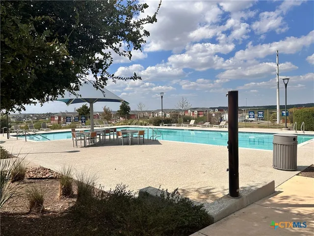 a view of outdoor space with playground and green space