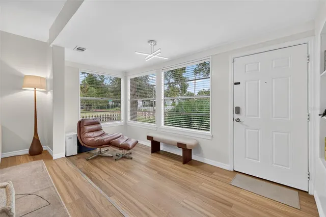 a bedroom with furniture and a window