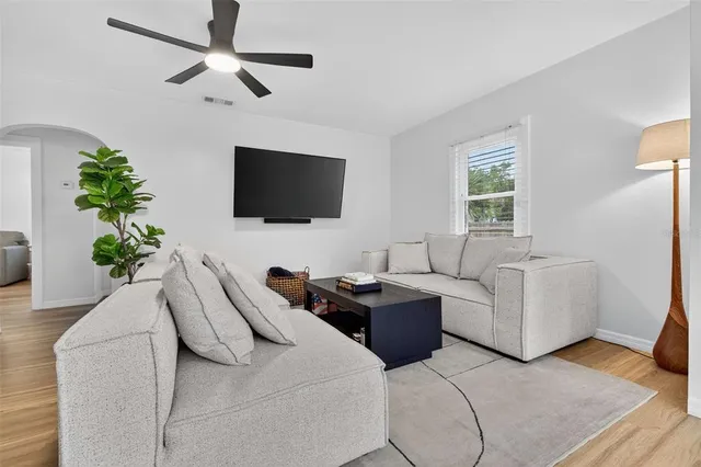 a living room with furniture and a flat screen tv