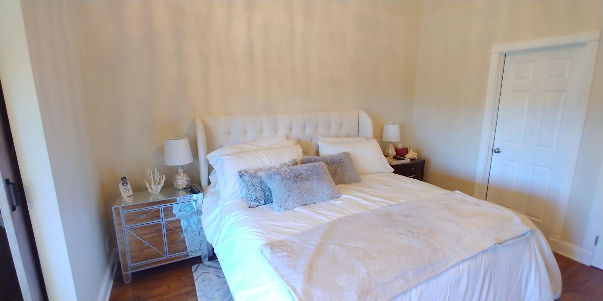 17042 Traverse Circle Jupiter, FL 33477 - Photo 15 of 30 a bedroom with a bed and a cabinets