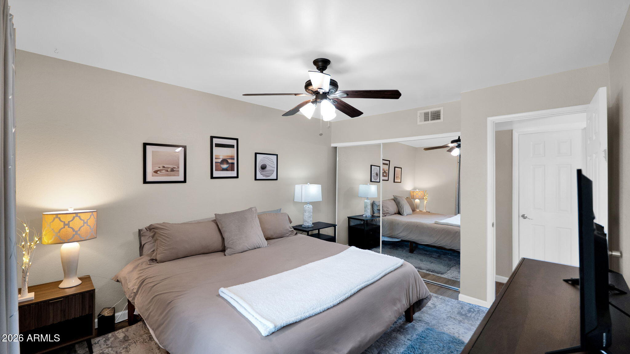 3500 North Hayden Road, Unit 1708 Scottsdale, AZ 85251 - Photo 12 of 25 a spacious bedroom with a bed and a chandelier
