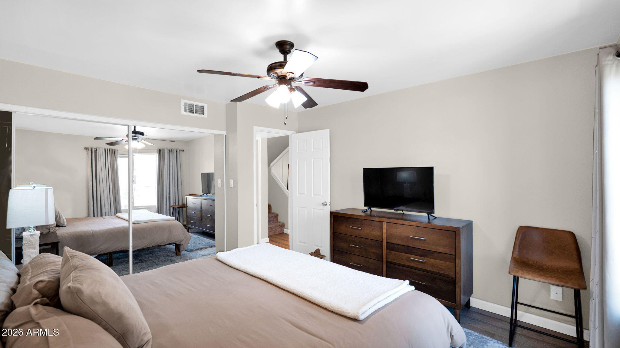 3500 North Hayden Road, Unit 1708 Scottsdale, AZ 85251 - Photo 13 of 25 a bedroom with furniture and a flat screen tv