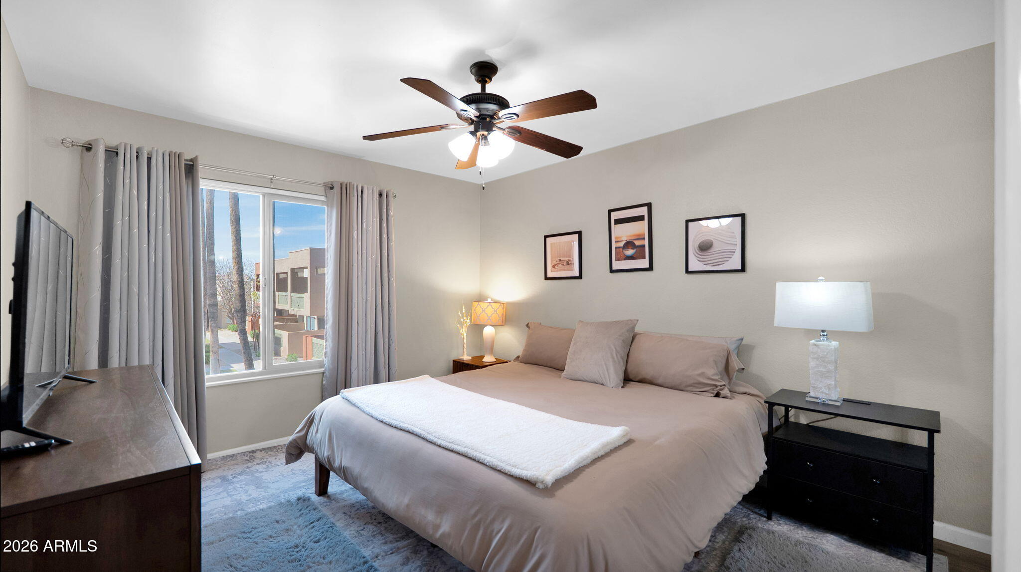 3500 North Hayden Road, Unit 1708 Scottsdale, AZ 85251 - Photo 5 of 25 a bedroom with a large bed and a flat tv screen