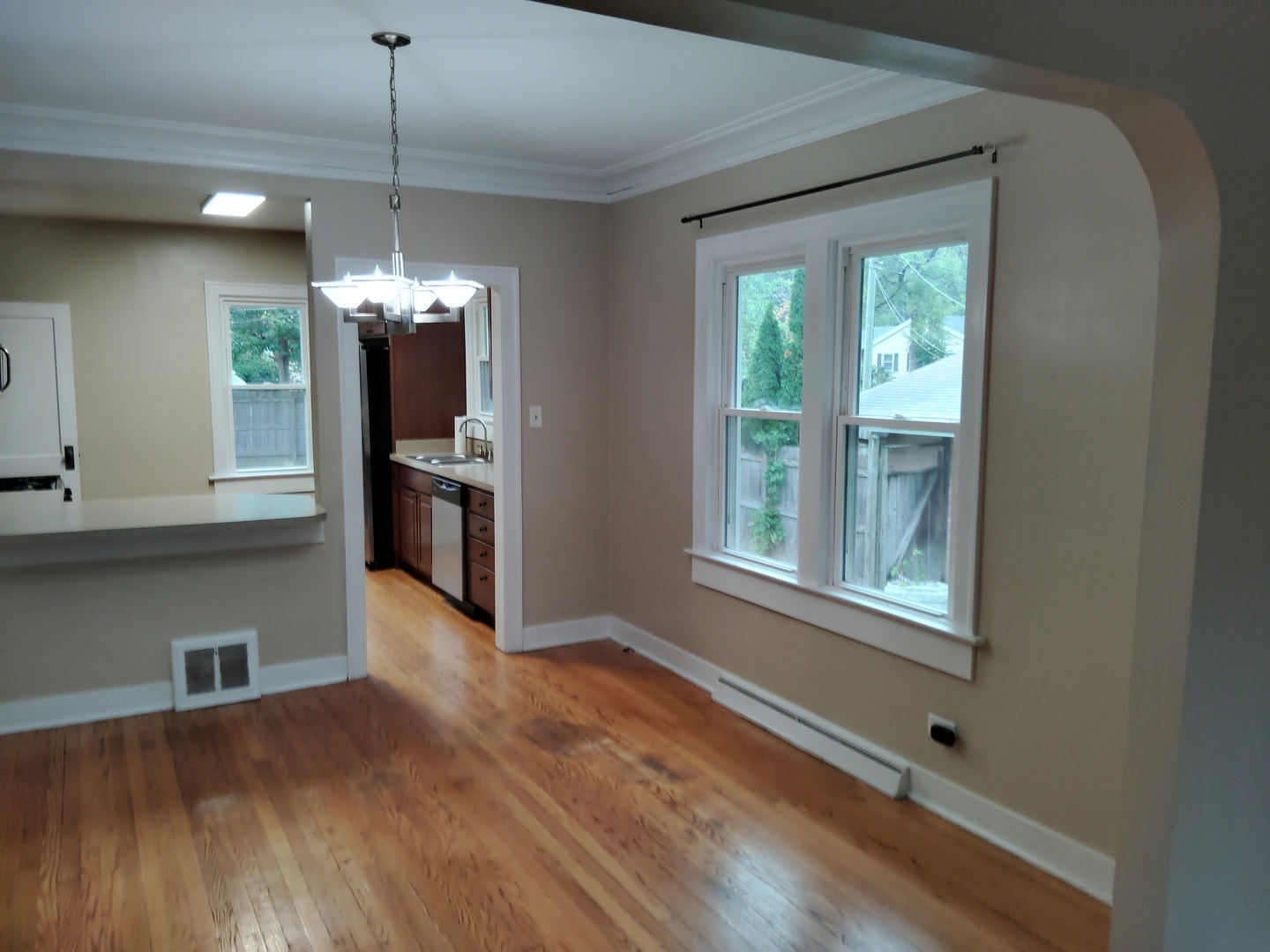 1406 Birch Road Homewood, IL 60430 - Photo 3 of 31 a view of a kitchen with a stove cabinets and a wooden floor