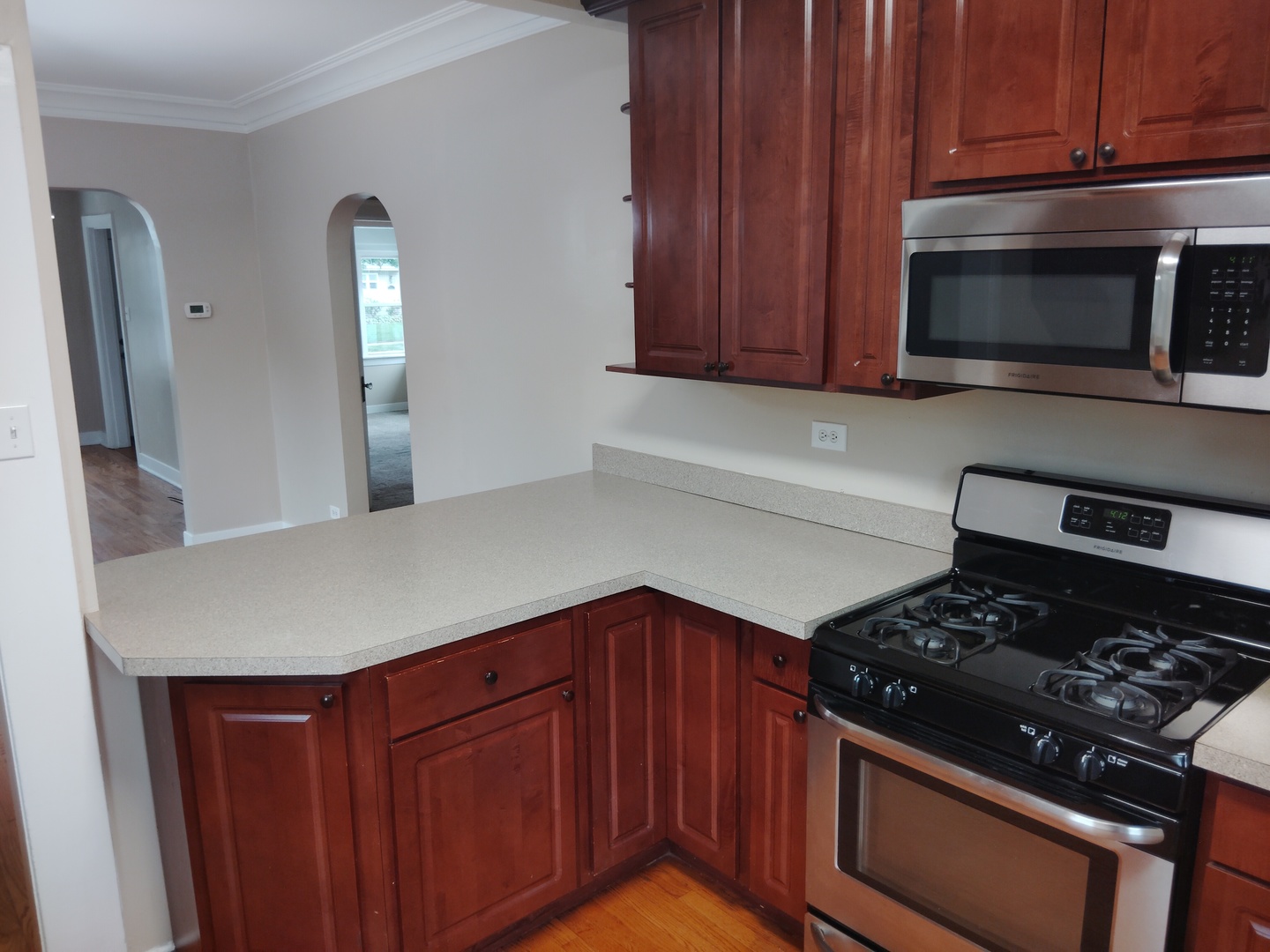 1406 Birch Road Homewood, IL 60430 - Photo 8 of 31 a kitchen with wooden cabinets and stainless steel appliances