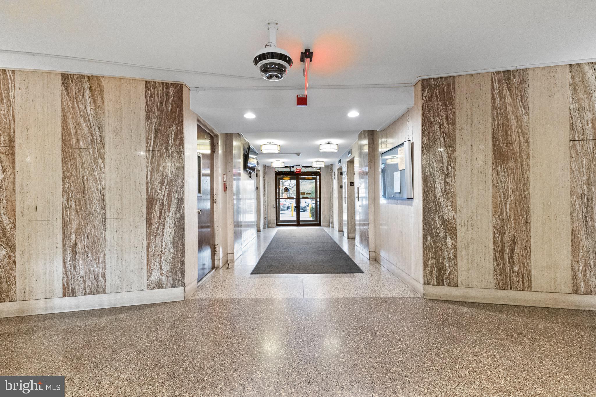 1111 University Boulevard West, Unit 313A Silver Spring, MD 20902 - Photo 15 of 20 a view of entryway and hall with a couch