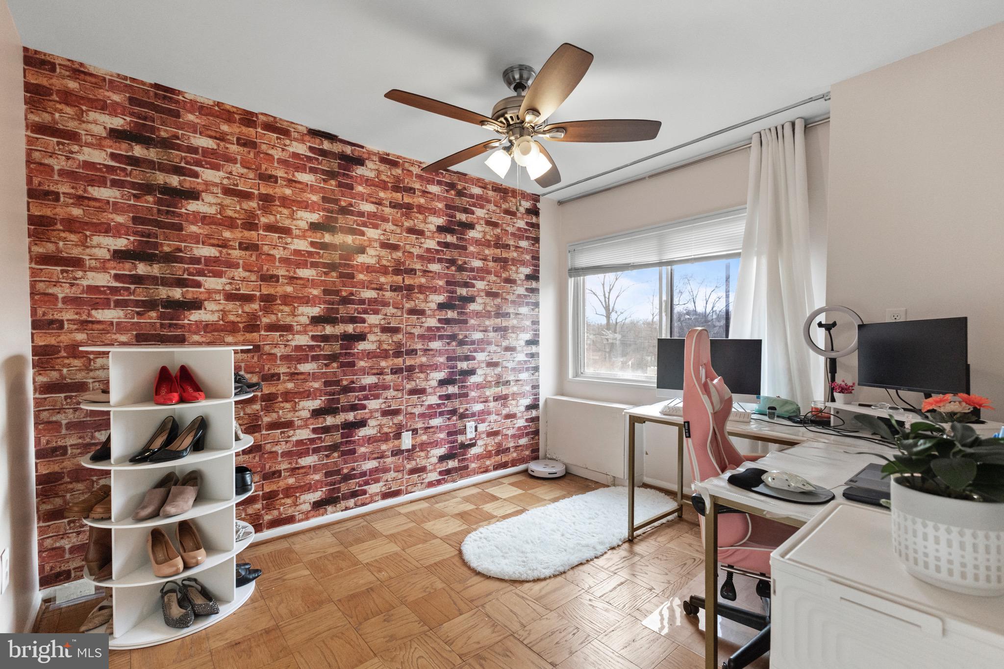 1111 University Boulevard West, Unit 313A Silver Spring, MD 20902 - Photo 5 of 20 a work room with furniture and a window