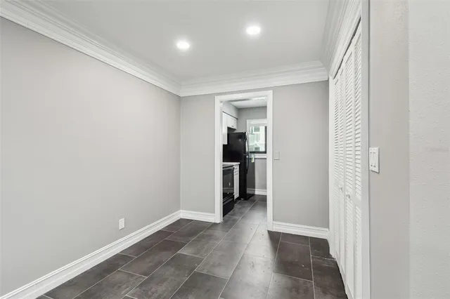 a kitchen with a sink cabinets and window