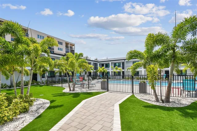 a view of swimming pool with outdoor seating