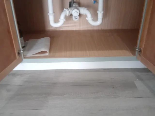 a view of a lake with houses in the background