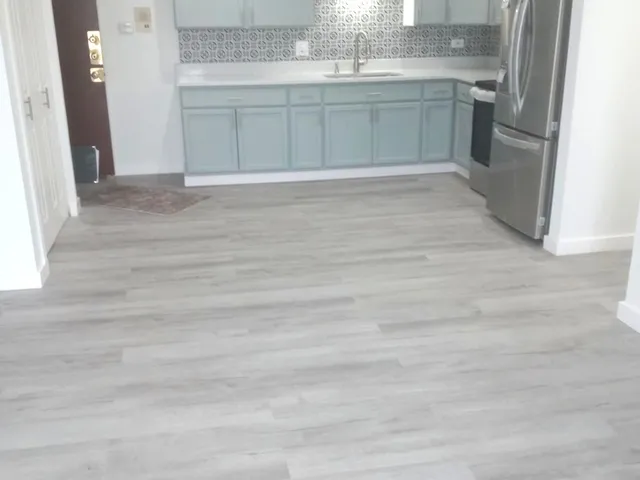 a view of a kitchen with a sink