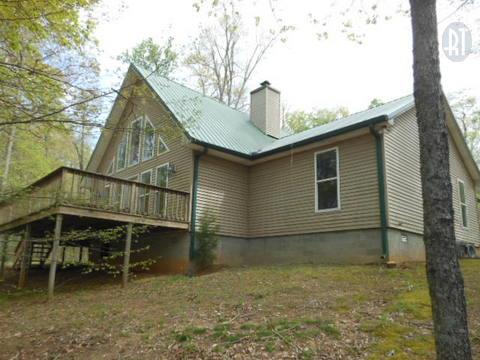 986 Maxwell Branch Road Cottontown, TN 37048 - Photo 1 of 13 a house with trees in the background