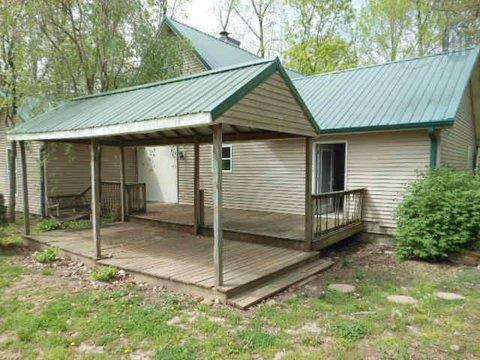 986 Maxwell Branch Road Cottontown, TN 37048 - Photo 5 of 13 a front view of a house with a garden
