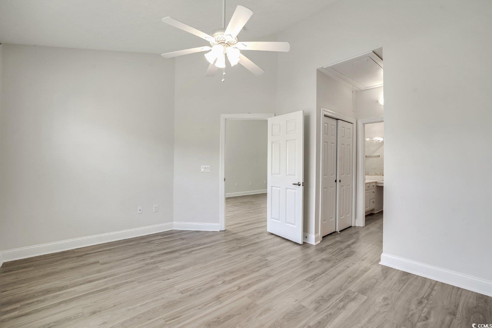 1113 Peace Pipe Place, Unit 204 Myrtle Beach, SC 29579 - Photo 12 of 27 Spare room with attic access, a ceiling fan, and light wood-type flooring