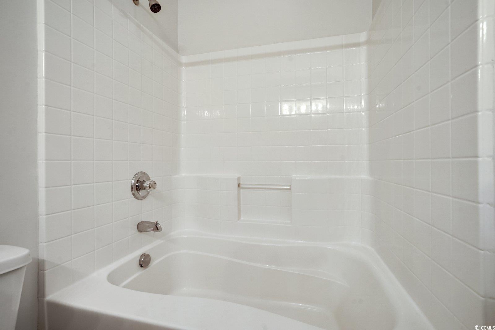 1113 Peace Pipe Place, Unit 204 Myrtle Beach, SC 29579 - Photo 14 of 27 Bathroom with a shower and a tub to relax in
