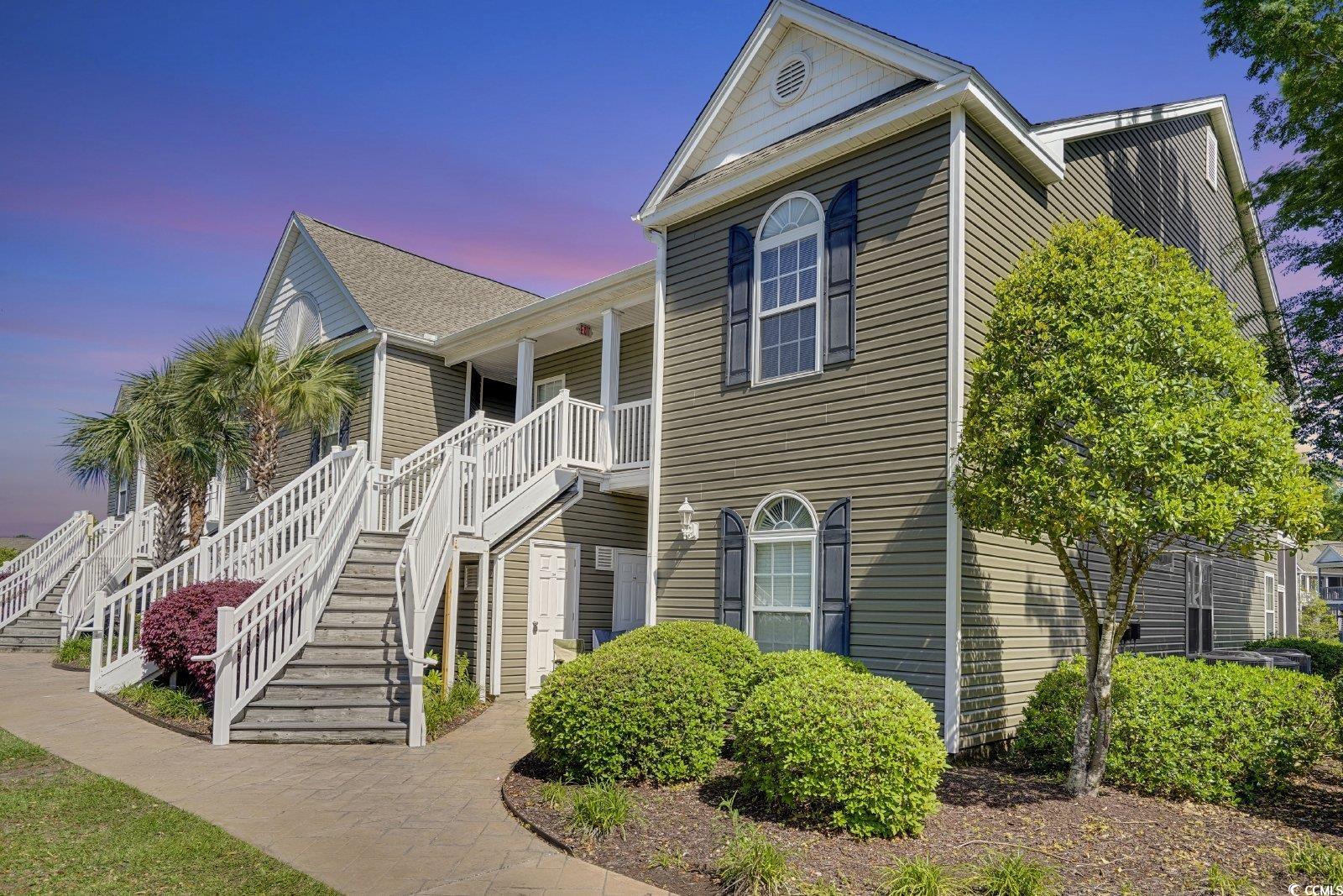 1113 Peace Pipe Place, Unit 204 Myrtle Beach, SC 29579 - Photo 3 of 27 View of front of house featuring stairway and covered porch