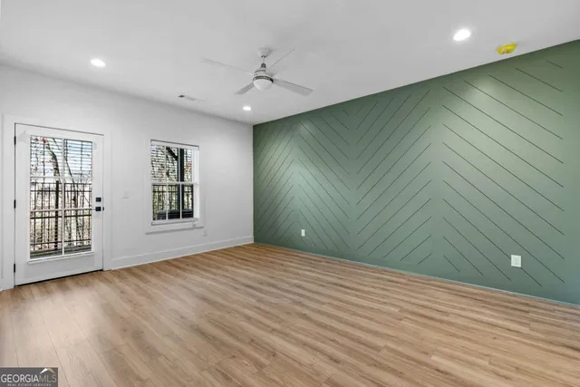 a view of an empty room with white walls