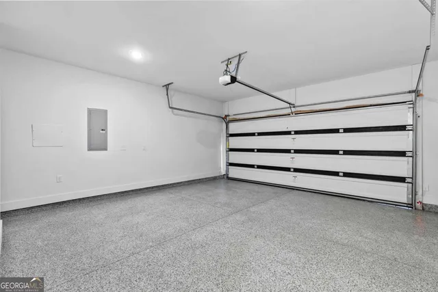 a view of building with cars parked