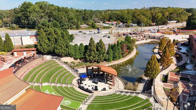 an aerial view of residential house with outdoor space and parking