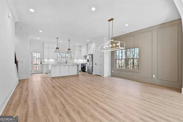 a kitchen with a sink cabinets and window
