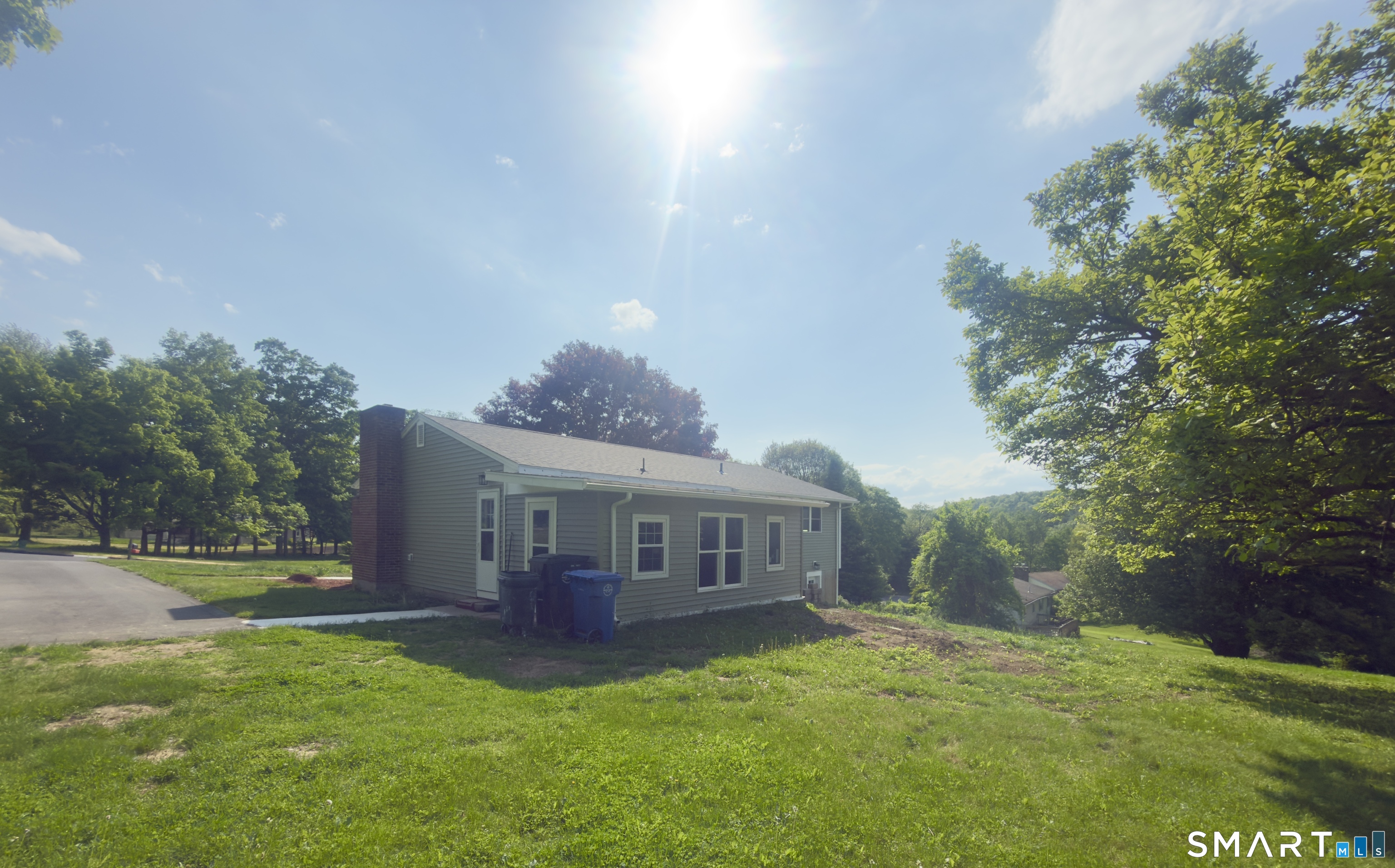 44 Polly Avenue Killingly, CT 06239 - Photo 3 of 22 a view of a house with backyard and a patio