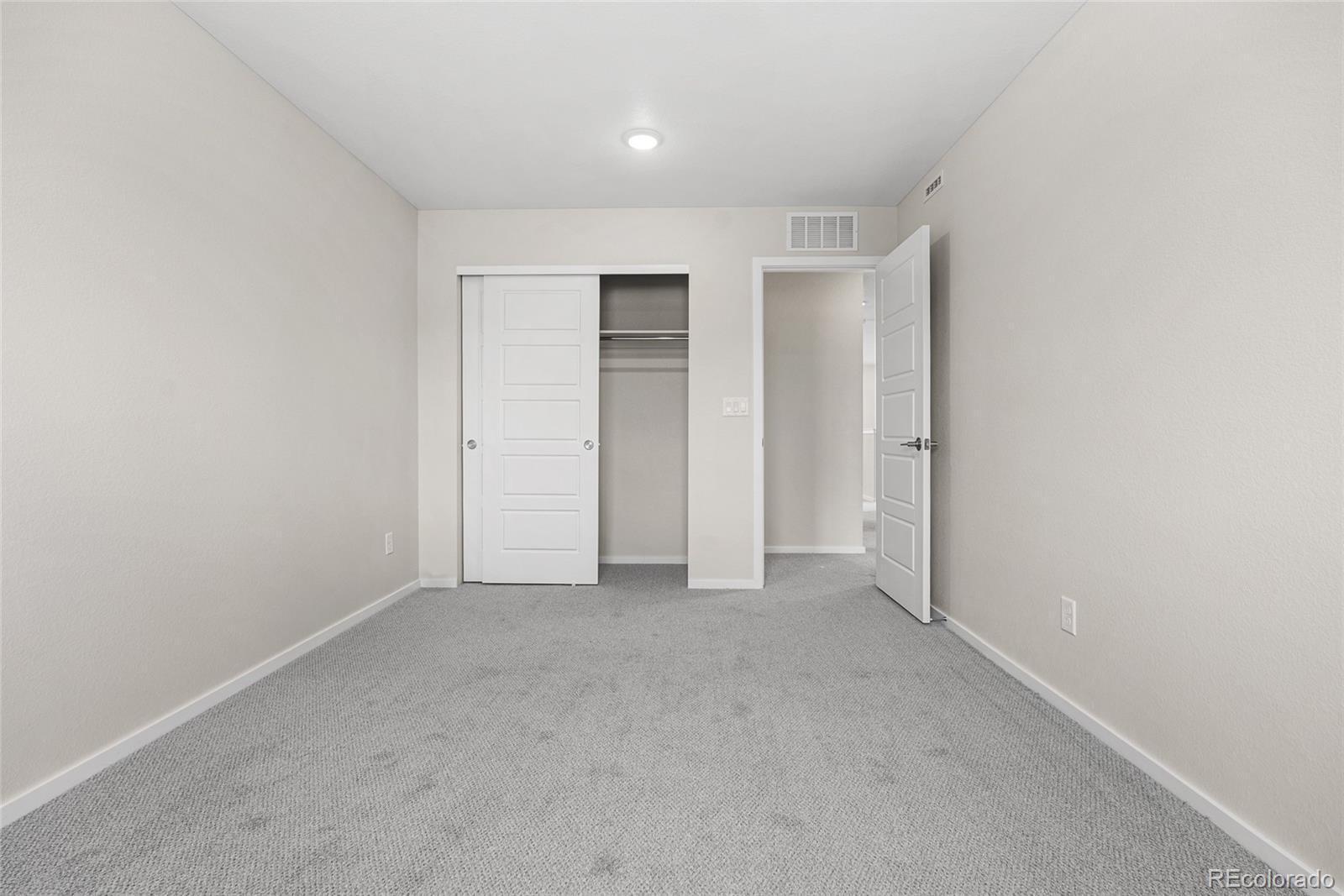 13181 Front Porch Lane Firestone, CO 80504 - Photo 22 of 34 an empty room with closet area