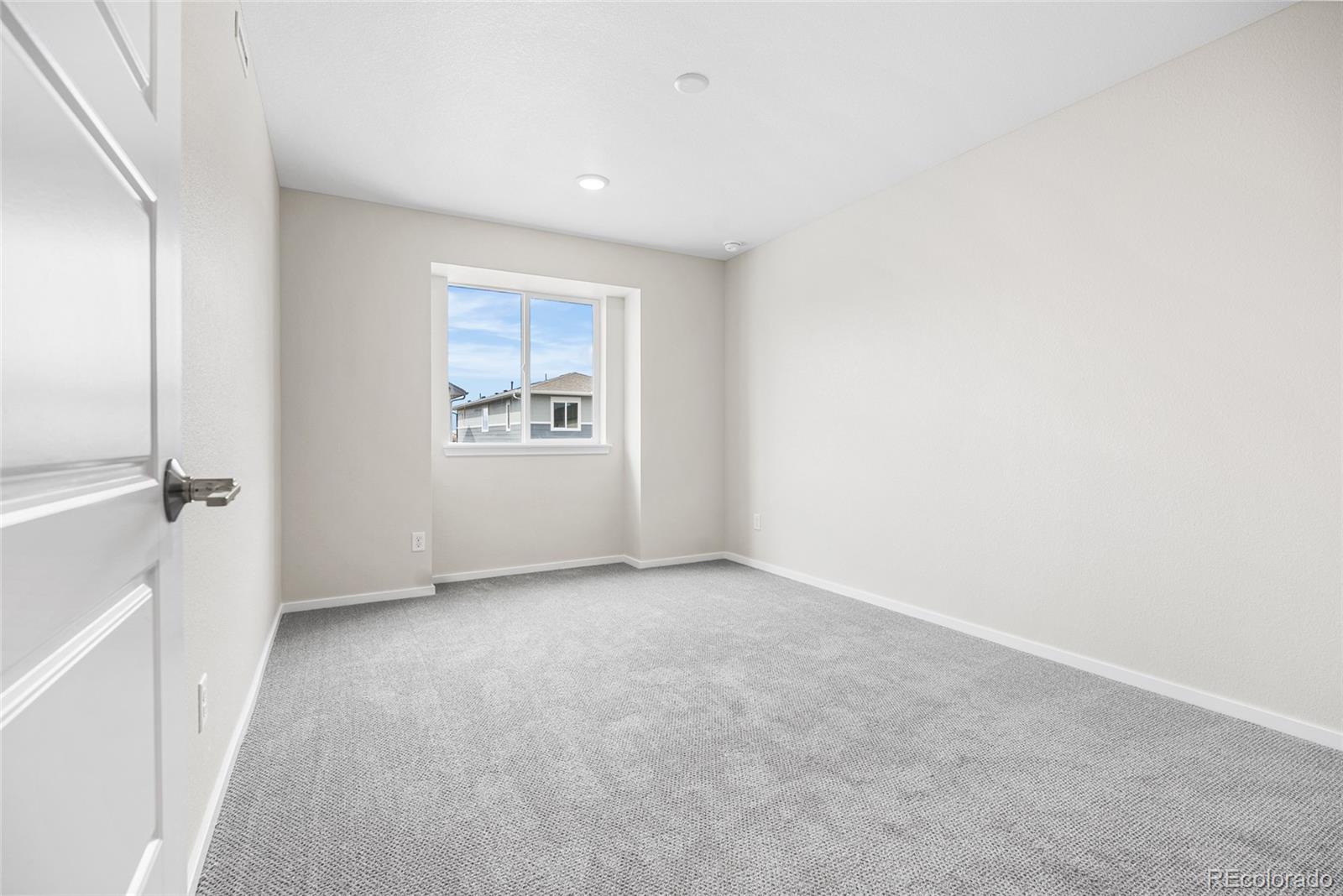 13181 Front Porch Lane Firestone, CO 80504 - Photo 23 of 34 an empty room with windows