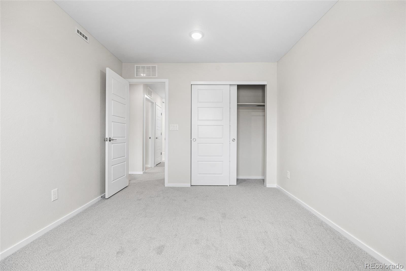 13181 Front Porch Lane Firestone, CO 80504 - Photo 24 of 34 an empty room with closet area