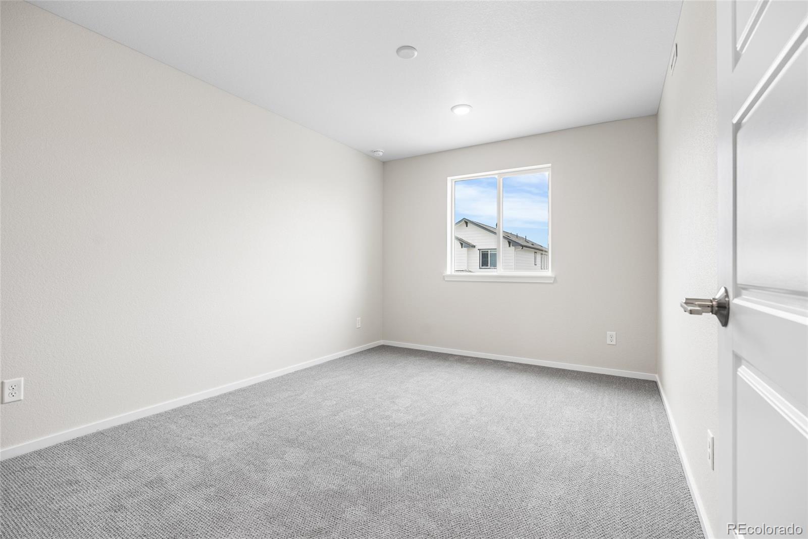 13181 Front Porch Lane Firestone, CO 80504 - Photo 25 of 34 an empty room with a window