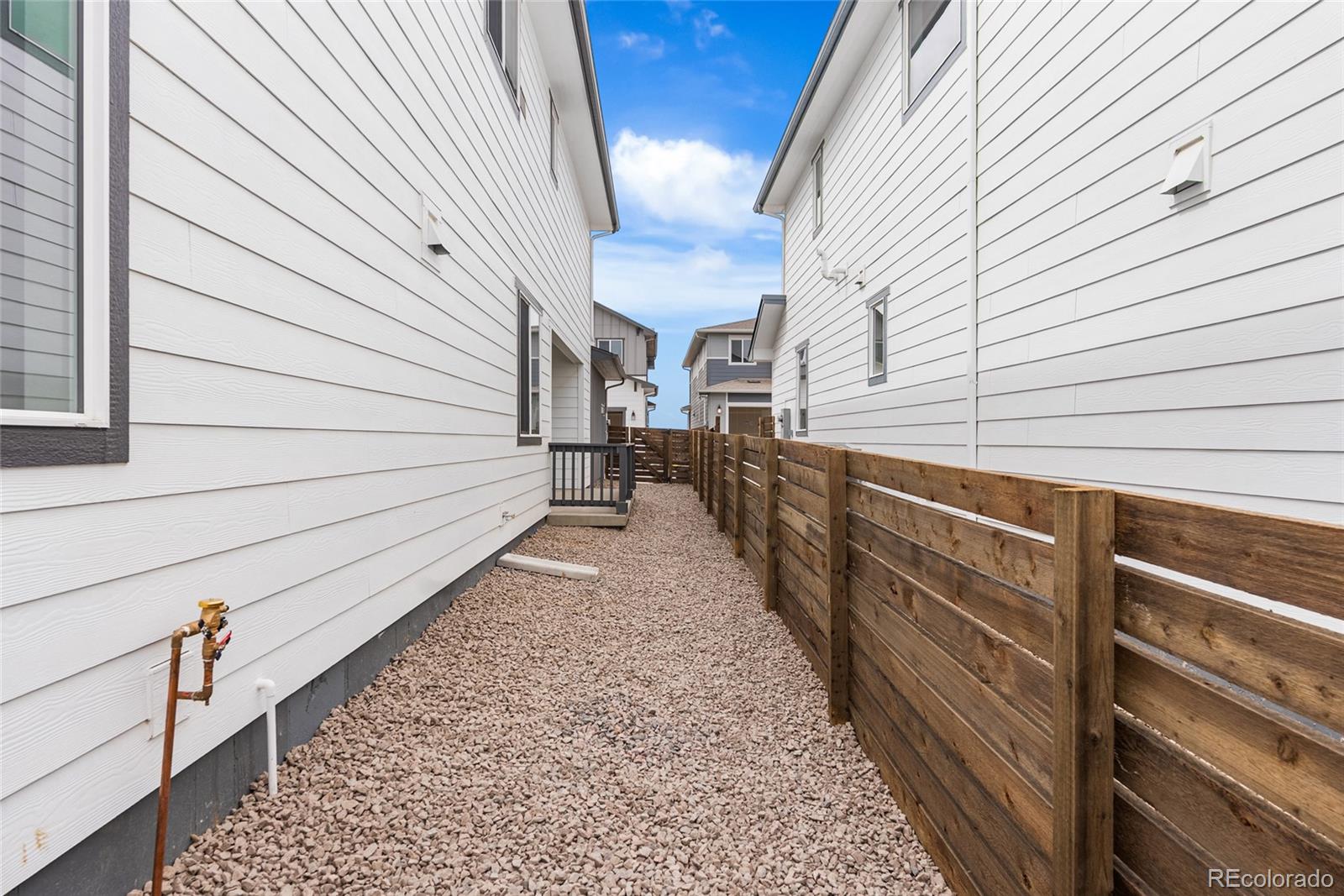 13181 Front Porch Lane Firestone, CO 80504 - Photo 31 of 34 a view of a pathway with a house