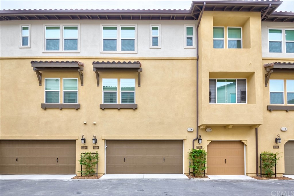 a front view of a building with a garage