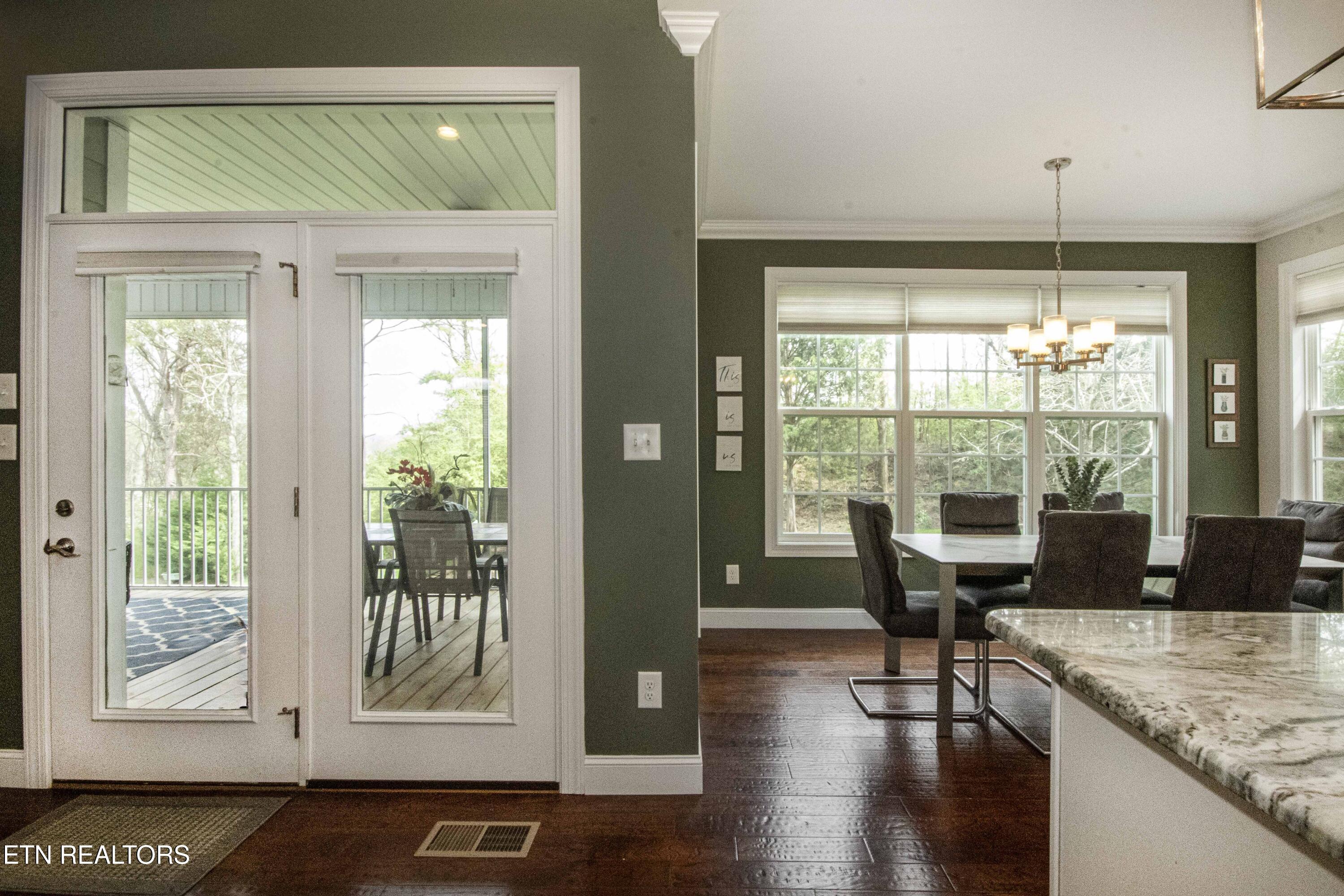 113 Inola Place Loudon, TN 37774 - Photo 20 of 42 Dining Area and Entry to Screened Porch
