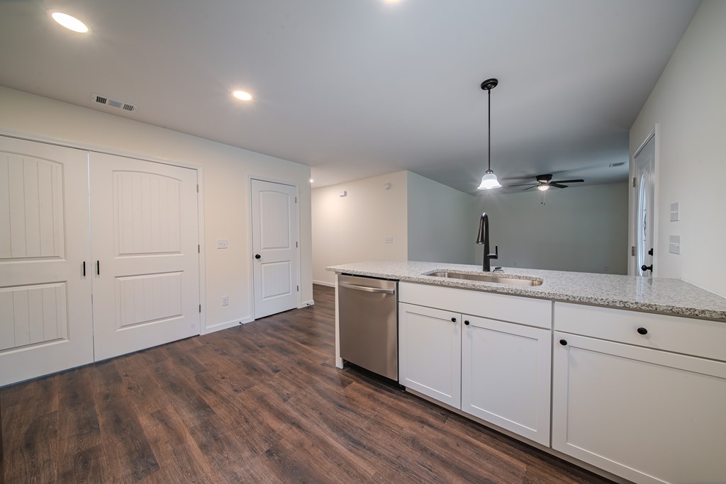 4410 Forrest Road Columbus, GA 31907 - Photo 12 of 30 a kitchen with white cabinets and sink