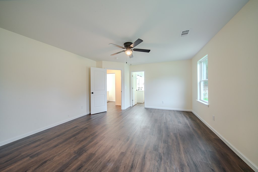 4410 Forrest Road Columbus, GA 31907 - Photo 16 of 30 wooden floor in an empty room with a window