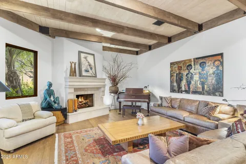 a spacious bedroom with a bed and a fireplace