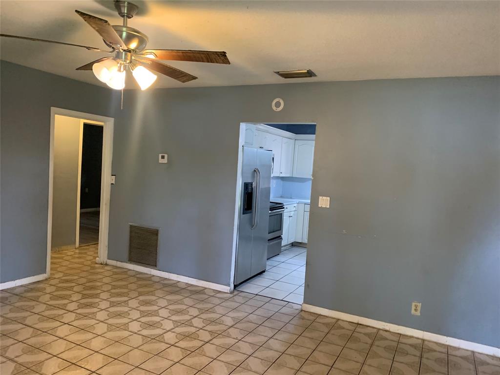 1080 Southwest 14th Street Deerfield Beach, FL 33441 - Photo 6 of 7 a view of a hallway with a chandelier fan and fire place