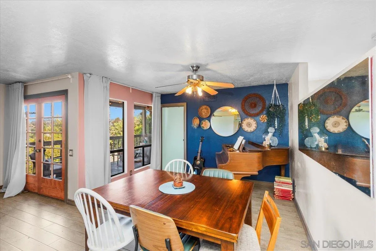 8621 Golf Drive Spring Valley, CA 91977 - Photo 11 of 41 a view of a dining room with furniture and chandelier