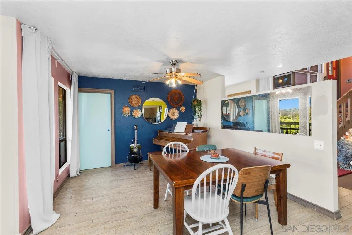 8621 Golf Drive Spring Valley, CA 91977 - Photo 12 of 41 a view of a dining room with furniture and chandelier